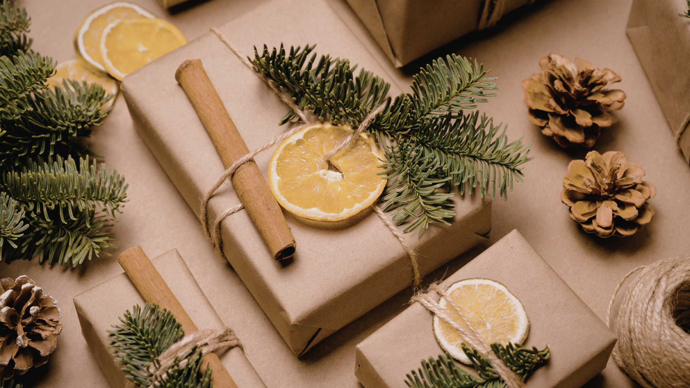 Gift boxes wrapped in brown paper with decorative elements on a matching background